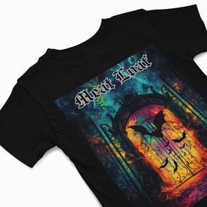 May include: Black t-shirt featuring a colourful graphic print of a gate with bats flying in front of it. The text "Meat Loaf" is printed in white at the top of the graphic.