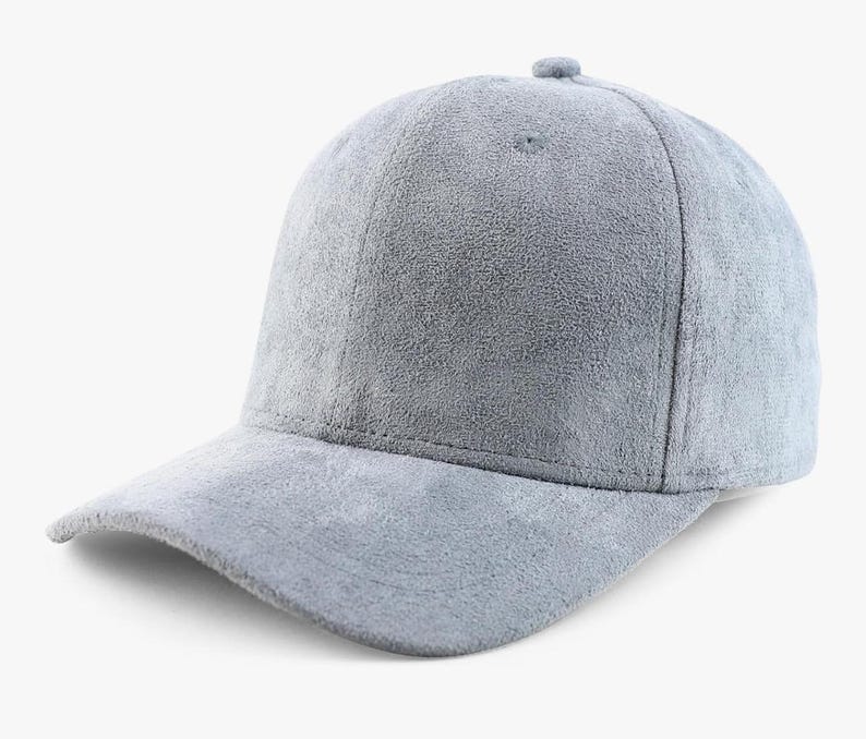 May include: A gray suede baseball cap with a curved brim.