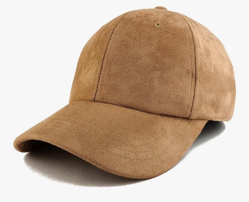 May include: A brown suede baseball cap.