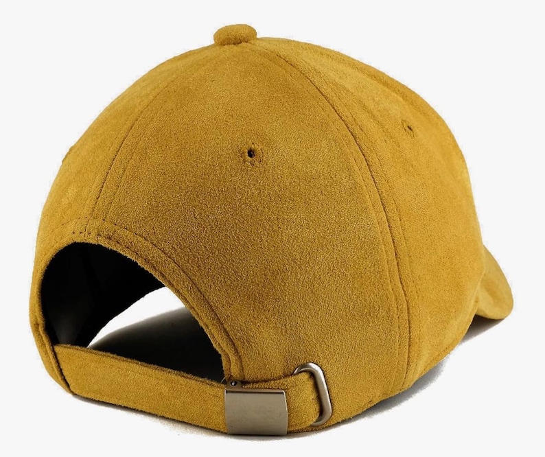 May include: A mustard yellow suede baseball cap with an adjustable strap.