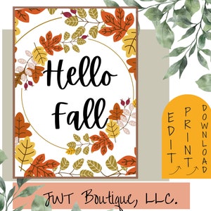 Könnte beinhalten: Ein druckbarer digitaler Download eines Schilds mit der Aufschrift "Hello Fall" auf weißem Hintergrund und einem Kreis aus bunten Herbstblättern. Der Text "JWT Boutique, LLC." befindet sich am unteren Rand des Schilds.