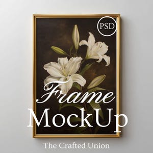 May include: A framed floral print featuring white lilies against a dark background. The gold frame surrounds the artwork, with the words "Frame MockUp" in white script. The Crafted Union is printed at the bottom.