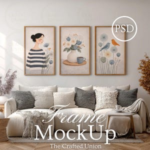 May include: A living room scene featuring a white sofa with decorative pillows and a throw blanket. Above the sofa are three framed art prints with floral and figure illustrations. The text "Frame MockUp" and "The Crafted Union" are visible.
