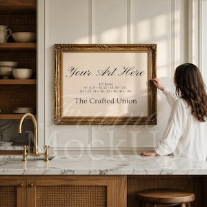 May include: A framed artwork mockup with a gold ornate frame. The artwork features the text "Your Art Here" and size ratios. The Crafted Union logo is at the bottom. The frame is hanging on a white wall in a kitchen setting.