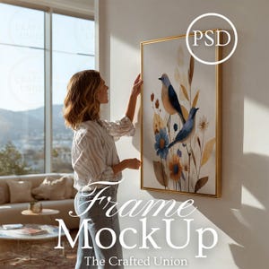 Puede incluir: Una impresión artística enmarcada con aves y elementos florales en acuarela en tonos azules, naranjas y beige. La obra de arte se muestra en un marco dorado. El texto "Frame MockUp" y "The Crafted Union" son visibles.