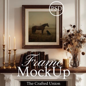 May include: A framed artwork featuring a horse and dog in a field, displayed above a mantel. The mantel is decorated with gold candlesticks, books, a vase of dried flowers, and a candle. The text "Frame MockUp" is displayed on the mantel.