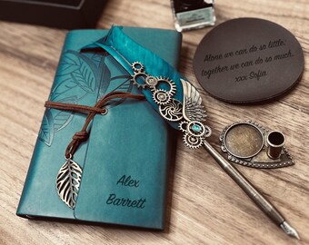 May include: A teal leather journal with a personalized inscription "Alex Barrett" and a decorative metal feather pen with gears and a turquoise gem. The journal has a brown leather strap and a leaf charm. A black leather coaster with the quote "Alone we can do so little: together we can do so much. xxx Sofia" is also in the image.