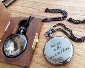 May include: Two antique silver pocket watches with chains. One watch has Roman numerals and the other has the inscription "I love you to the moon and back".