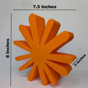 A large, orange,sunburst-shaped  logo is shown with text indicating its dimensions: "Large," "7.5 Inches" wide, "8 Inches" tall, and "2 Inches" deep.