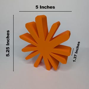 A small, orange, sunburst-shaped logo is shown with text indicating its dimensions: "Small," "5 Inches" wide, "5.25 Inches" tall, and "1.37 Inches" deep.