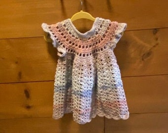 Baby girls crocheted lacy dress.