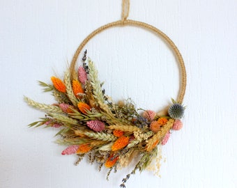 Wall decoration with dried and preserved flowers, mixed bouquet