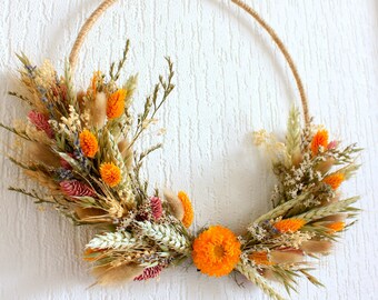 Wall decoration with dried and preserved flowers, mixed bouquet