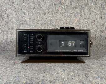 Reloj vintage Longines Symphonette Flip con alarma y radio