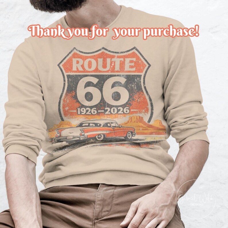 May include: Beige long-sleeve sweatshirt featuring a Route 66 graphic. The graphic includes the words "ROUTE 66", the number "66", and the years "1926-2026". A vintage car and desert landscape are also depicted. The text "Thank you for your purchase!" is at the top.