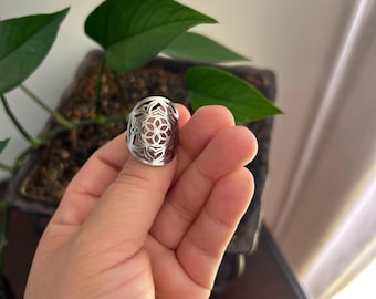 Adjustable stainless steel Flower of Life ring.