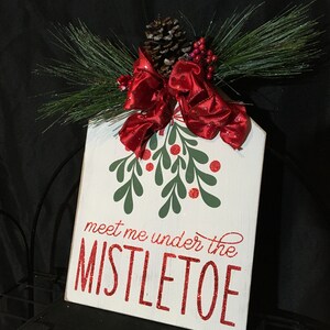 Under the Mistletoe Sign