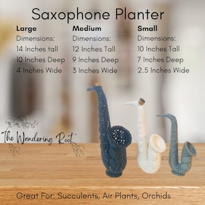 May include: Three saxophone-shaped planters in black, white, and gray. The planters are made of ceramic and have a textured finish. The planters are labeled "Large", "Medium", and "Small" with their dimensions listed in inches. The text "The Wandering Root" is visible in the lower left corner of the image. The text "Great For: Succulents, Air Plants, Orchids" is visible in the lower center of the image.