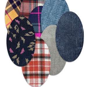 May include: A collection of oval-shaped fabric patches in various patterns and textures, including yellow and navy plaid, red plaid, blue denim, navy corduroy with white pinstripes, grey ribbed fabric, and black fabric with pink and tan leaf motifs.