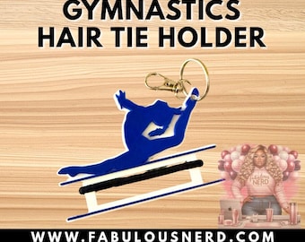 May include: A blue gymnastics hair tie holder featuring a gymnast silhouette performing a split on a white balance beam, attached to a gold-toned metal keyring. The text GYMNASTICS HAIR TIE HOLDER and WWW.FABULOUSNERD.COM are visible in the image.