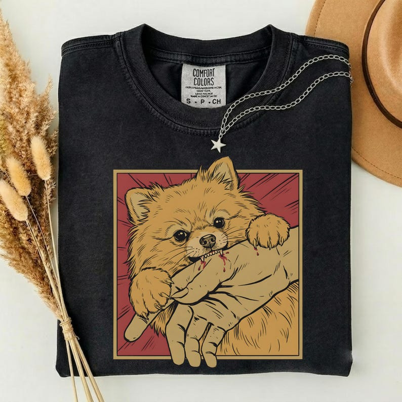 Vintage pomeranian bite shirt with Japanese horror anime style retro graphic dog design