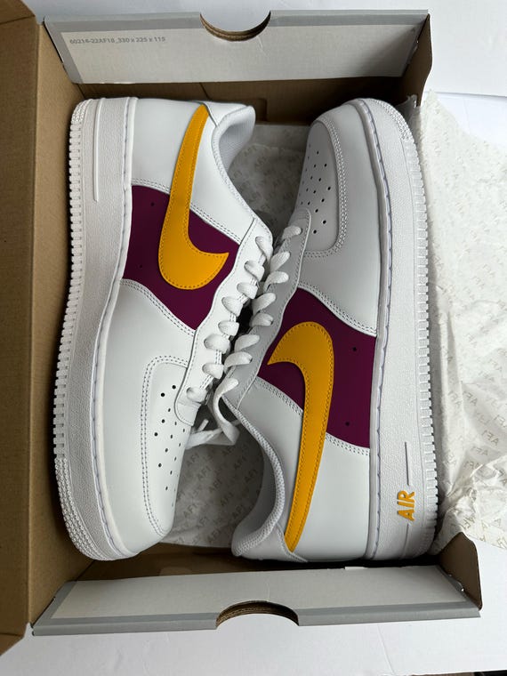 burgundy and yellow nike