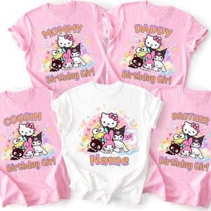 May include: Pink and white t-shirts with cartoon characters and text. The pink shirts say "Mommy", "Daddy", "Cousin", and "Brother" of the Birthday Girl. The white shirt says "Name" and "Birthday Girl".