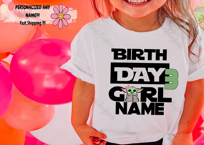 May include: White t-shirt with black text that reads "BIRTHDAY 3 GIRL NAME". A green cartoon character with pink bows is above the word "GIRL".