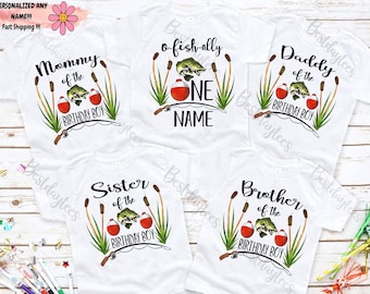 May include: Four white t-shirts with a fishing theme. The shirts say "Mommy of the Birthday Boy", "Daddy of the Birthday Boy", "Sister of the Birthday Boy", and "Brother of the Birthday Boy". One shirt says "o-fish-ally one NAME".