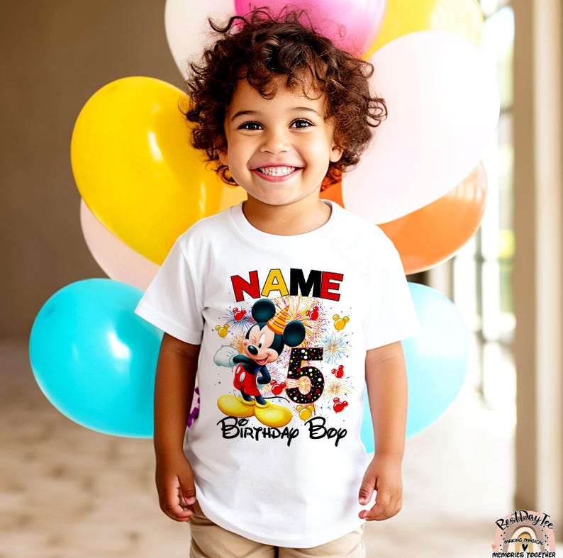 May include: White t-shirt with a Mickey Mouse graphic, fireworks, and the text "NAME 5 Birthday Boy".
