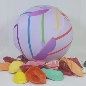 Purple and orange striped balloon cover toy