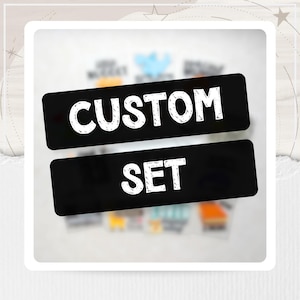 May include: Two rectangular black labels with white, distressed-style lettering. The top label displays the word CUSTOM, and the bottom label displays the word SET. The background features blurred, out-of-focus colorful rectangular items.