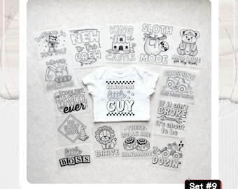 May include: A white short-sleeved baby bodysuit featuring the text "HANDSOME little GUY" surrounded by a checkered border, displayed with twelve iron-on transfer sheets containing various black and white graphic designs and phrases.