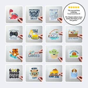 May include: A collection of sixteen square iron-on transfers featuring various colorful graphic designs including a dinosaur, construction vehicles, a tiger on a skateboard, a cactus, a basketball, a bear, and a puppy, with assorted text phrases.