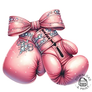 以下が含まれることがあります： ラインストーンで飾られた大きなピンクのリボンが付いたピンクのボクシンググローブ。グローブはグリッターとラインストーンで飾られています。