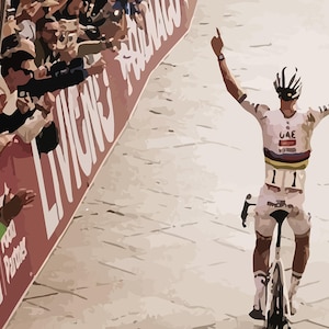 May include: A cyclist wearing a white and black jersey with the word "UAE" on the front, raises both arms in victory as they cross the finish line. The cyclist is wearing a white helmet and is riding a black bicycle.