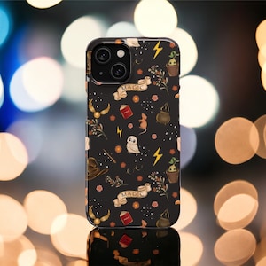 May include: A black phone case with a magical theme. The case features a variety of illustrations, including a book, a cauldron, a wand, a phoenix, a hat, and a small owl. The text "Magic" appears twice on the case.