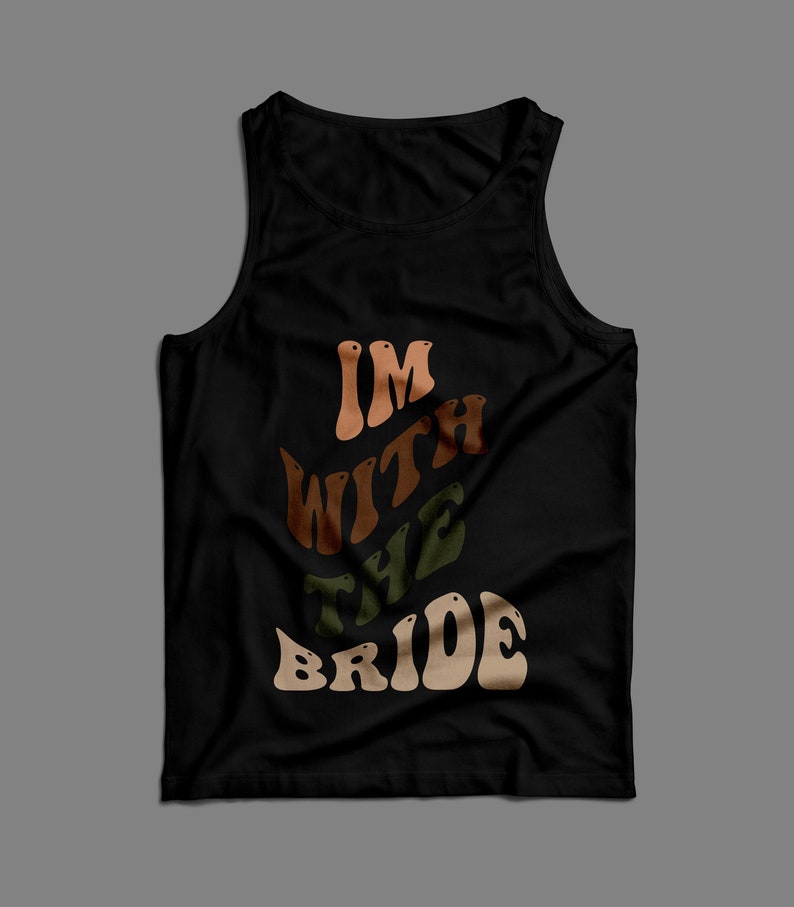 May include: Black tank top with the text "I'm with the bride" in a retro font with brown, orange, and green colors.