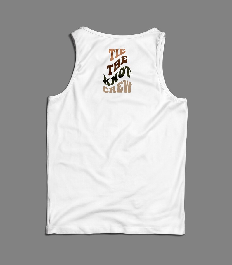 May include: White tank top with the text "TIE THE KNOT CREW" printed on the back in brown, orange, and green.