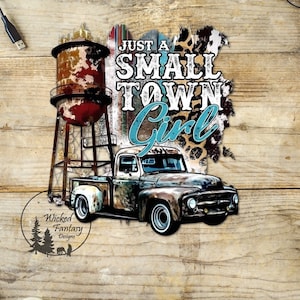 May include: A rusty, vintage pickup truck with a water tower in the background. The truck is driving on a dirt road. The text "Just a Small Town Girl" is written in a blue and white font on a leopard print background.