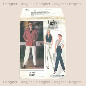 May include: A Vogue American Designers sewing pattern envelope for Anne Klein, number 2672. The front features a photograph of a person in a red blazer and white trousers, alongside illustrations of two outfits with blouses and trousers.