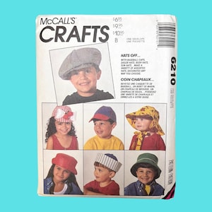 May include: A sewing pattern for making children's hats. The pattern includes instructions for making a variety of hats, including baseball caps, sailor hats, bush hats, and sun hats. The pattern is from McCall's Crafts and is numbered 6210.