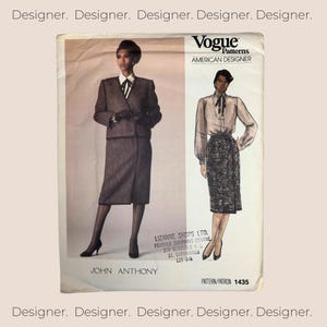 May include: A vintage Vogue Patterns sewing pattern for a skirt and jacket suit. The pattern is for American Designer John Anthony and has the pattern number 1435.