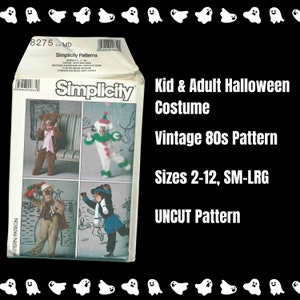 May include: A vintage Simplicity pattern for kid and adult Halloween costumes. The pattern features images of various costume designs, including a bear, clown, and other characters. The pattern is from the 1980s and includes sizes 2-12 and SM-LRG.