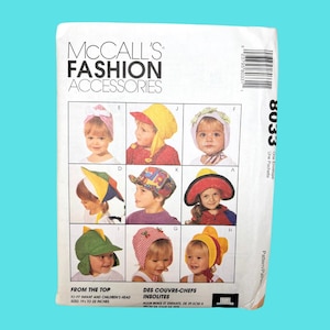 May include: A sewing pattern for eight different styles of children's hats. The pattern is called "McCall's Fashion Accessories" and the pattern number is 8033. The hats are designed to fit infants and children with head sizes from 19.5 to 22 inches.