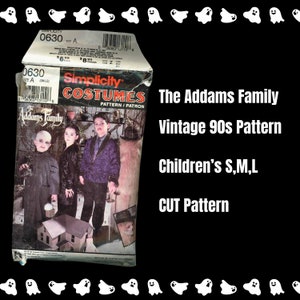 May include: Vintage Simplicity pattern for The Addams Family costumes. The pattern is for children's sizes S, M, and L. The pattern cover features illustrations of the Addams Family characters.