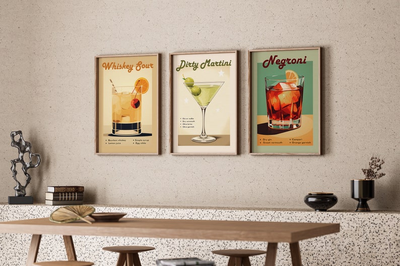 May include: Three framed vintage-style cocktail posters with illustrations of a Whiskey Sour, a Dirty Martini, and a Negroni. Each poster includes the drink's name, ingredients, and instructions.