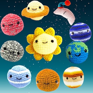 May include: A collection of crocheted celestial bodies, including planets, a sun, and a Saturn-like ringed planet. Each has a smiling face and is made with various colors of yarn. The background is a gradient of blue with white star-like dots.