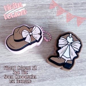 May include: Two-piece set of brown and pink fidget clickers, one shaped like a cowboy hat with a bow, the other a cowboy boot with a bow. The text "DIGITAL DOWNLOAD" and "FIDGET CLICKER X2" is visible.