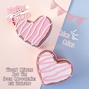 May include: Two heart-shaped fidget clickers with pink icing and white drizzle, set against a pink and blue backdrop. Text includes "Digital Download," "Quick Quick," and "Fidget Clicker 3MF File Small Commercial Use Included."